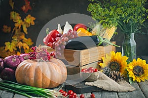 The table, decorated with vegetables, pumpkins and fruits. Harvest Festival, Happy Thanksgiving. Autumn background