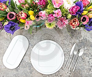 Table decoration colorful spring flowers Holidays place setting