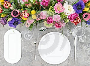 Table decoration colorful spring flowers Holidays place setting