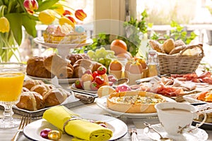 Table with delicatessen ready for Easter brunch