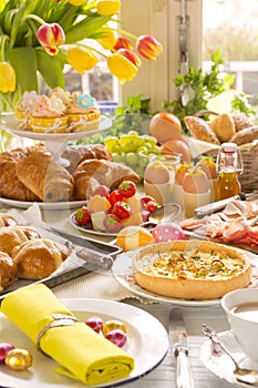 Table with delicatessen ready for Easter brunch photo