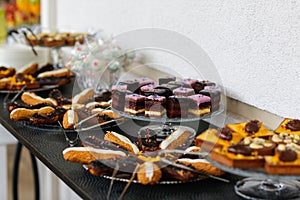 Table with delicious various cakes