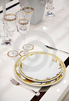 Table with dinner dishes and glasses