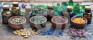 Table Displaying Bottles Filled With Various Herbs