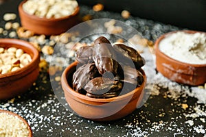 Table With Assorted Bowls Filled With Nuts