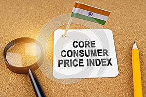 On the table is the flag of India and a sheet of paper with the inscription -core consumer price index.