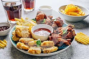 Table fof tasty snacks for beer prepared for watching sports on TV.