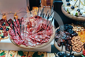 Table with food, tapas bar with spanish cuisine, cured meat, cheese and platter with other appetizers from spain, top view