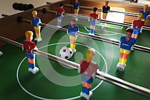 Table football game in progress creates a sense of excitement and competition