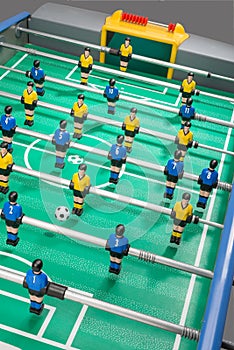 Table football with players and numbered shirts