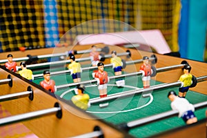 Table football soccer game on green field.Close-up