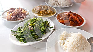 Table full of carinderia or karinderya dishes
