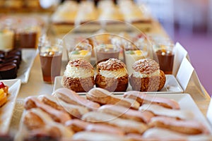 Table full with mini cakes and sweets
