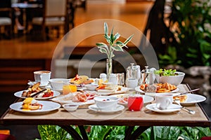 Table full of various fresh food in luxury modern restaurant in hotel