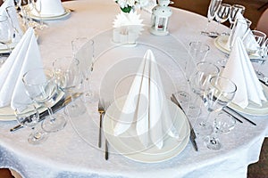 Table with glasses and napkins served for dinner in restaurant