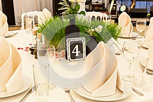 Table for guests in the wedding hall.