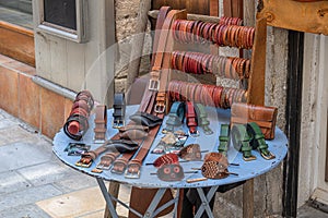 A table with handmade leather goods from a street vendor