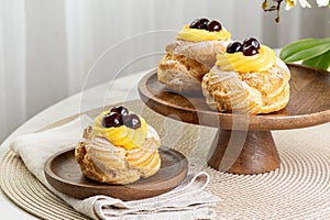 Table with Italian pastry - zeppole di San Giuseppe - baked puffs photo