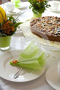 Table laid for coffee and cake photo