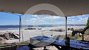 Table laid for dinner overlooking beach