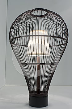 Table lamp in a cage