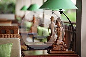 Table-lamp with sculpture of women in the green lamp