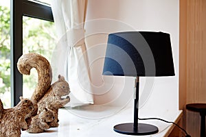 Table lamp on windowsill