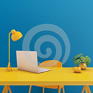 Table with laptop mock up.Yellow chair,lamp,table on blue background.Working space concept