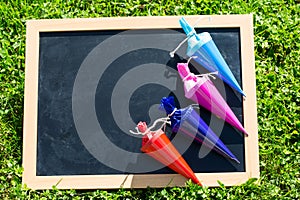 Table is in the meadow with school bags, school day