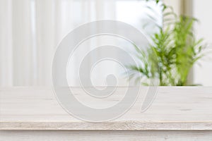 Table mockup for display of product over blurred window background