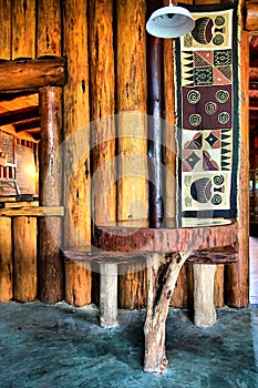 Table next to wooden wall in African restaurant