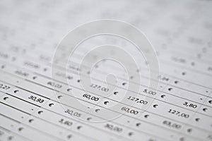 Table with numbers, Euro amounts, calculator, and coins.