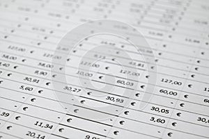 Table with numbers, Euro amounts, calculator, and coins.