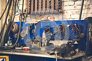 Table with parts and tools at car repair shop