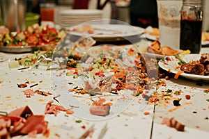 table after a party, dotted with food scraps