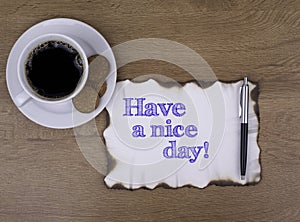 On the table a piece of paper and text. Have a nice day!