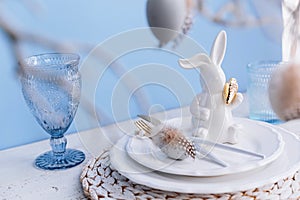 Table place setting with bunny figure and eggs