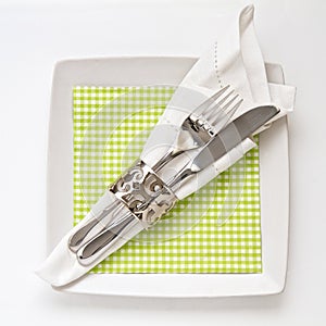 Table place setting with checkered serviette