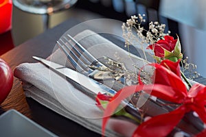 Table place setting with holidays decoration.