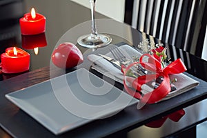 Table place setting with holidays decoration.