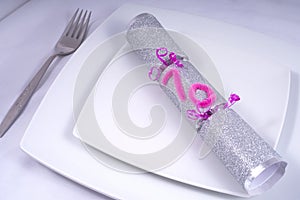 Table Place Setting with a Traditional Cracker for a 70th Birthday