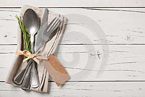 Table place setting. Vintage tableware on wooden background.