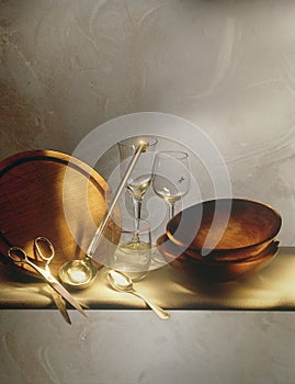 Table with plates, glasses, spoon and scissors
