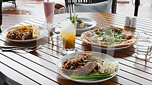 Table with prepared food and fruit smoothie in restaurant, dinner, lunch in cafe
