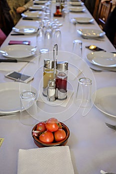 Table prepared with ingredients to make bread with tomato and garlic