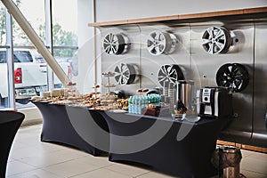 A table with refreshments at the presentation of new cars in the Toyota dealership.