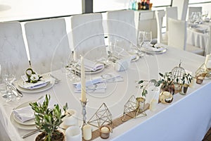 Table in a restaurant with flowers and candles