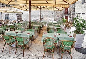 Table in the restaurant with glasses of wine and serving.