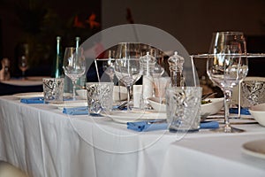 Table in the restaurant, served with wine glasses and ready to welcome guests