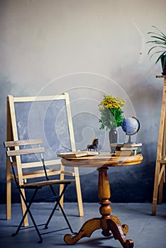 Table for school classroom, the chalkboard, a globe and open book, round table